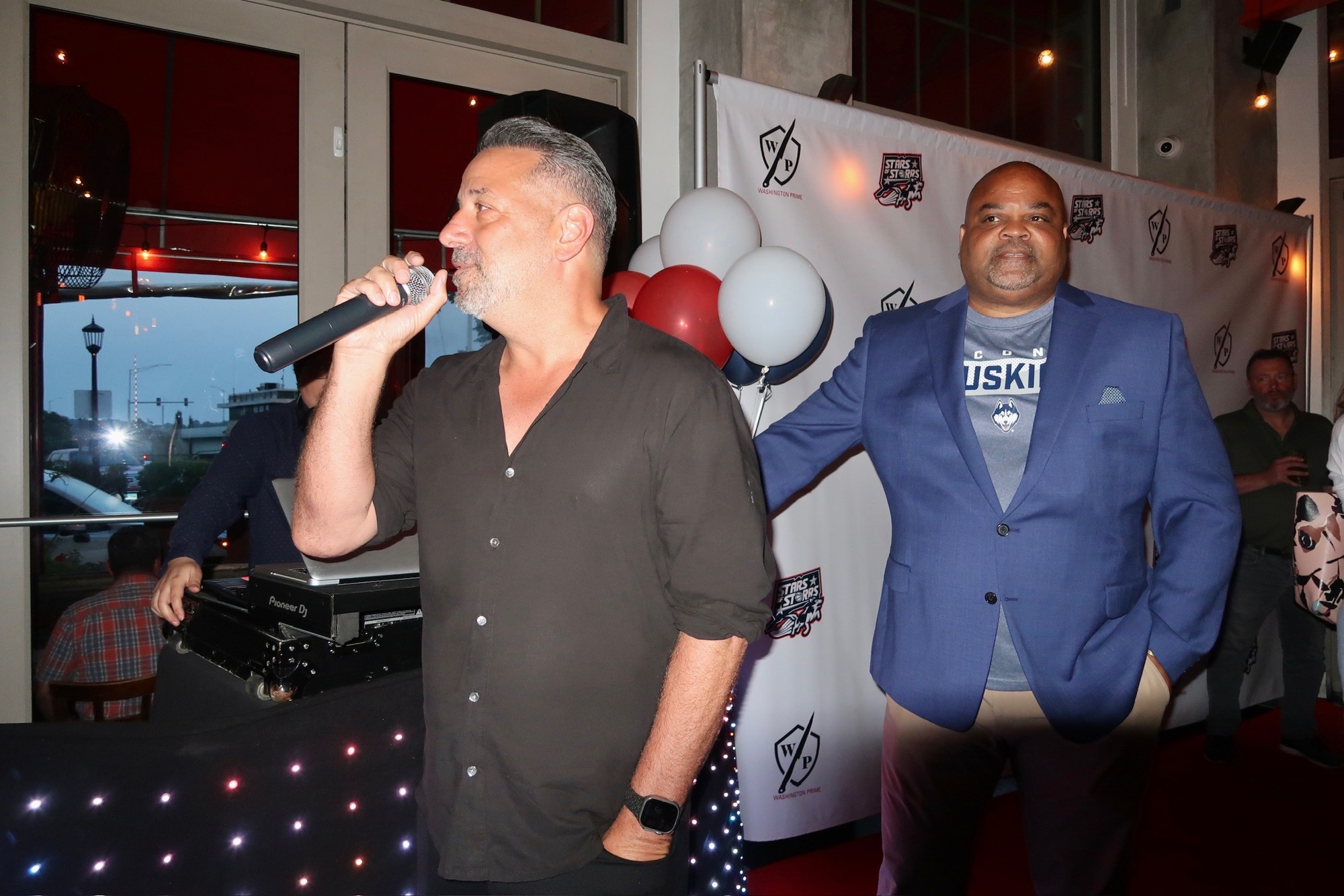 Marc D'Amelio on the microphone at a Stars of Storrs team event