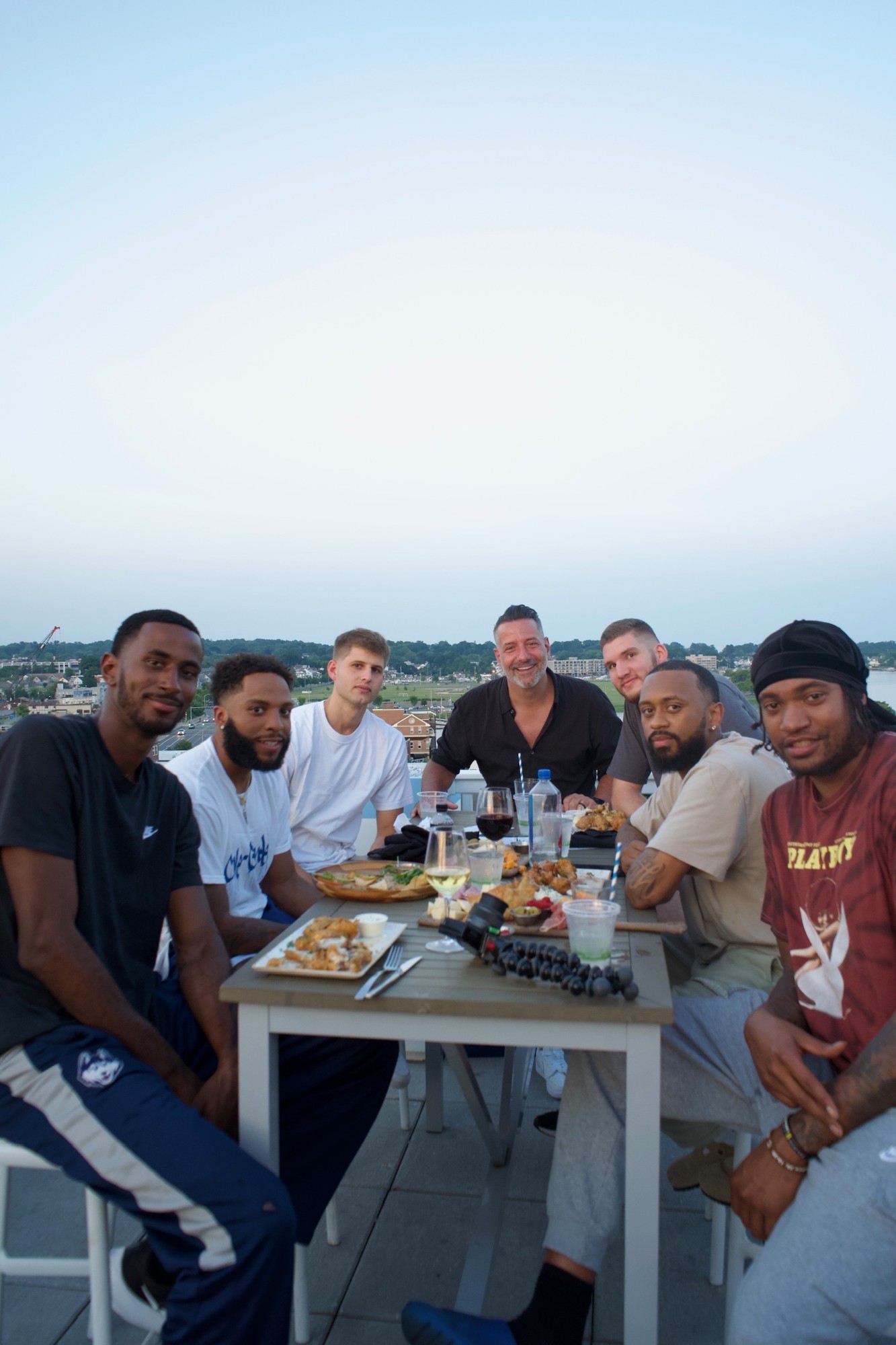 Marc D'Amelio and Stars of Storrs players at a rooftop team dinner